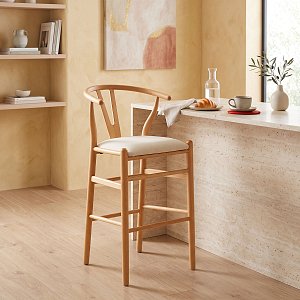 Σκαμπό μπαρ Wishbone pakoworld μεσαίου ύψους rubberwood-ύφασμα σε φυσική-μπεζ απόχρωση 51x60x95εκ 029-000465